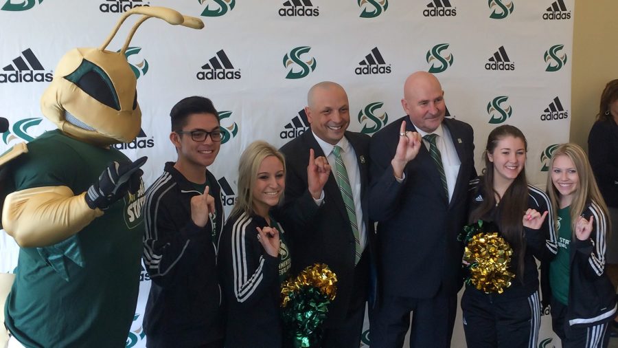 Newly named Sacramento State Athletic Director Mark Orr and Sac State President Robert Nelsen pose with students during Orrs introductory press conference Monday in the Terrace Suite at The WELL. (Photo by Angel Guerrero)
