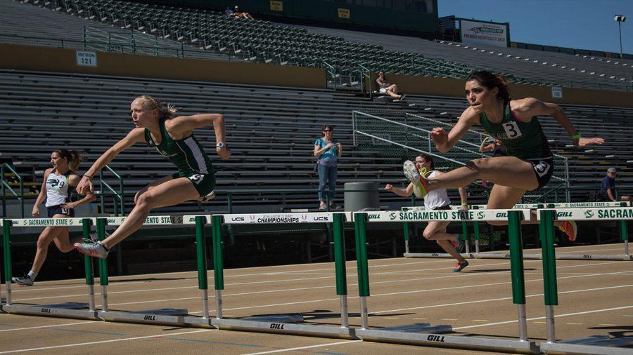 Sacramento State senior Elizabeth Venzon, left, and sophomore Emilia Del Hoyo compete in the 100 meter hurdles as a part of the heptathlon in the Hornet Invitational Friday at Hornet Stadium. (Photo by Matthew Nobert)