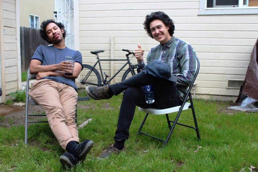 Derek Lynch, left, and Frank Lopes Jr., better known as Hobo Johnson and the Lovemakers, relax in the Oak Park backyard where they produce their music.  The group is set to return to Concerts in the Park after last years performance in Cesar Chavez Plaza.  