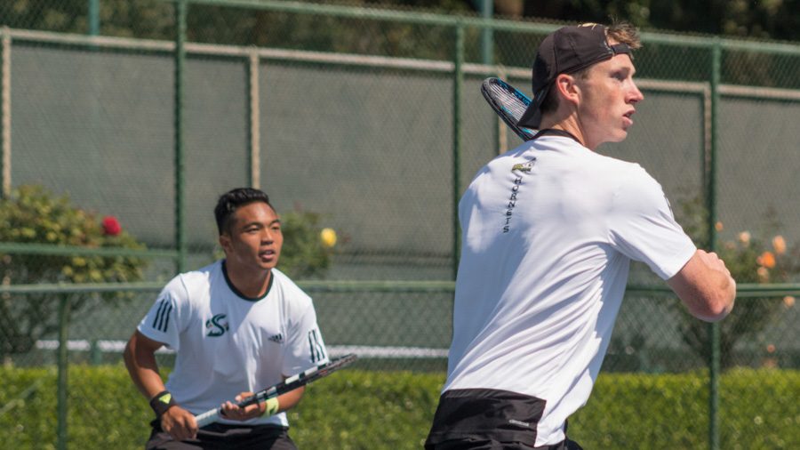 Sacramento State sophomore Dom Miller, right, and freshman Hermont Legaspi, left, get ready to return the ball during doubles play against Drexel Thursday at the Rio Del Oro Racquet Club. (Photo by Matthew Nobert)