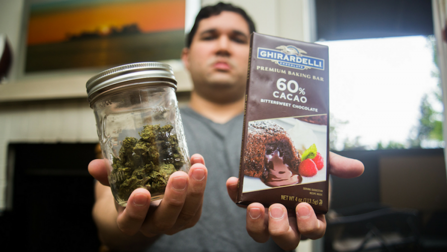 Sacramento State alumnus Vincent Martinez, 29, holds the tolls of his trade as a manufacturer of edible marijuana products. (Photo by Nicole Fowler)