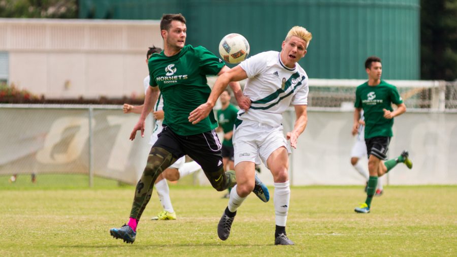 Sacramento State soccer commit and Cosumnes Oaks High School senior RJ Moorhouse battles for the ball at the Sac State alumni game Saturday at Hornet Field. (Photo by Matthew Dyer)