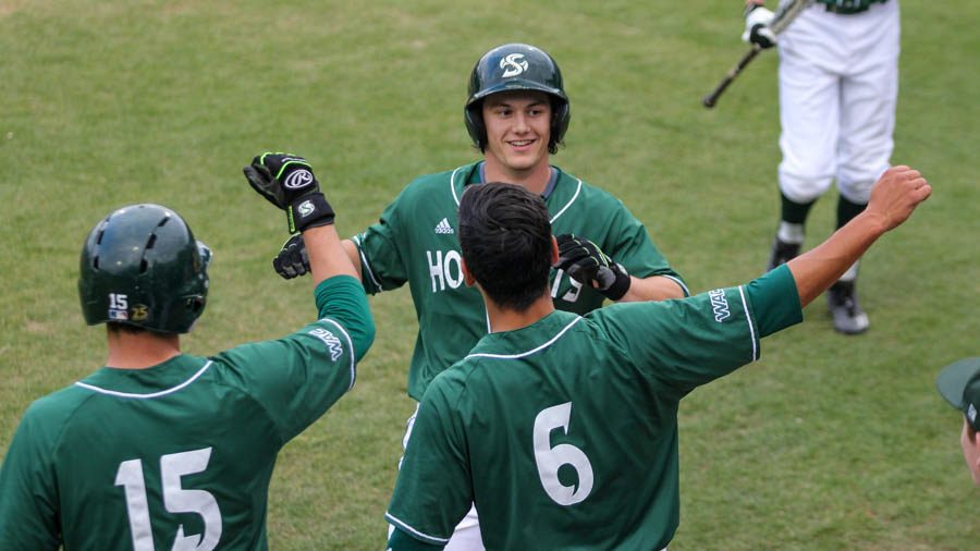 Sacramento State sophomore James Outman celebrates with his teammates after hitting a home run against UC Davis on April 11 at John Smith Field. (Photo by Max Jacobs)