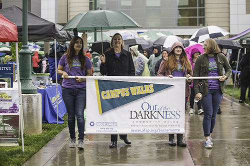 Jody Nelsen leads a crowd of supporters during the Out of the Darkness awareness event April 6, 2017. The walk is held annually to raise awareness about suicide prevention and mental health. (Photo by Nicole Fowler) 