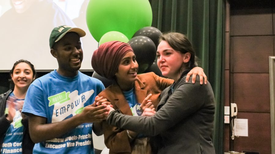 From right, Sacramento State junior Mia Kagianas embraces Karen Kaur Dhillon and Matthew Brooks-Pritchard after being revealed as the new ASI President at the ASI election results party in the Redwood Room in the University Union on Thursday, April 14. (Photo by Matt Lucas)