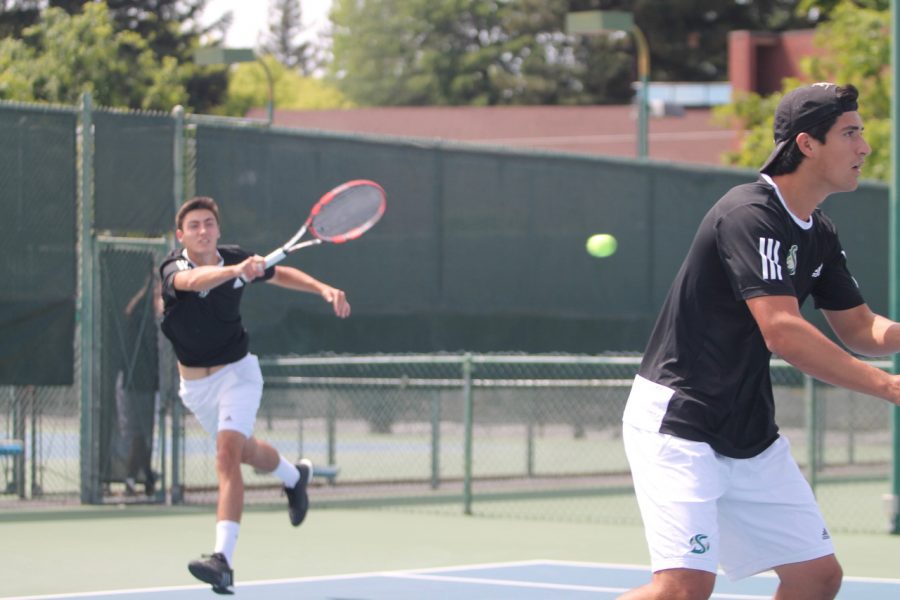 Sacramento State freshman Louis Chabut, left, returns the ball as sophomore Donald Hall, right, looks on during doubles play against Weber State Saturday at the Rio Del Oro Racquet Club. (Photo by Sami Soto)