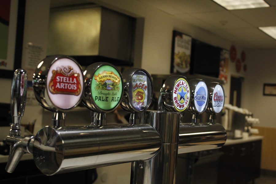 Beer tap handles are pictured here at the Round Table Pizza in the University Union on Tuesday, April 18, 2017. Students can order up to three alcoholic beverages a day on campus at three separate locations. (Photo by John Ferrannini)