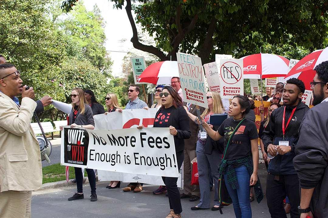 Members of the California Faculty Association and California State University students march on Wednesday from the Old Rose Garden in downtown Sacramento to the State Capitol. The protest intended to advocate for increased funding of higher education. (Photo by Carlo Marzan)