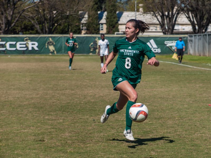 Sacramento State  junior forward Kylee Smith looks for an open teammate against Cal during a March 12 scrimmage at Hornet Field. (Photo by Andro Palting)