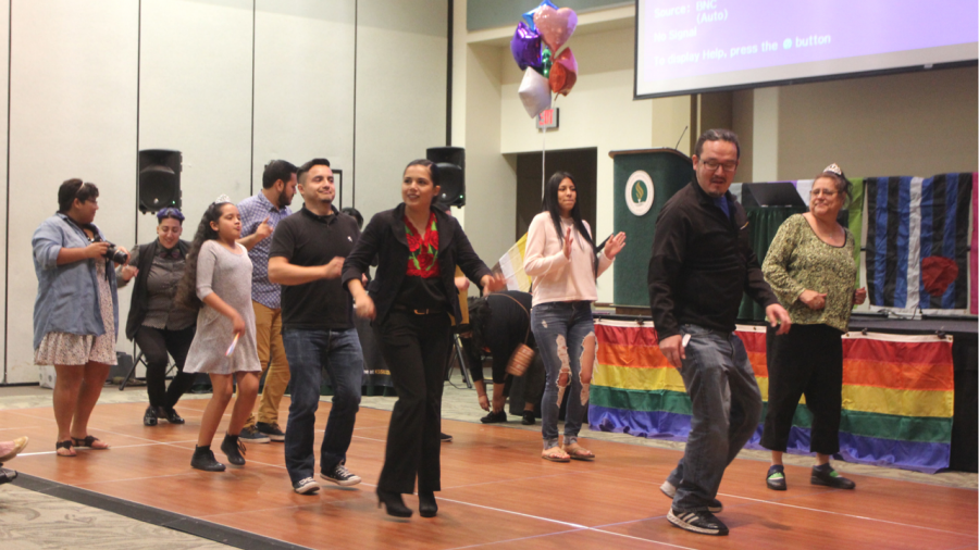 Attendees and staff members of the PRIDE Center dance and celebrate the centers 10th anniversary in the University Union Ballroom on April 28. (Photo by Khanlin Rodgers)