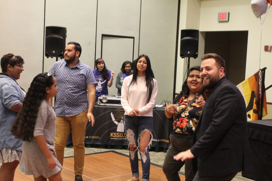 Attendees and staff members of the PRIDE Center dance and celebrate the center's 10th anniversary in the University Union Ballroom on April 28. (Photo by Khanlin Rodgers)