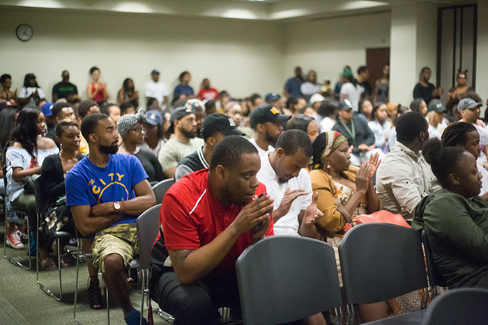 Close friends and colleagues gather for Isaiah Alexander's vigil in the University Union Orchard Suite on May 3. (Photo by Nicole Fowler)