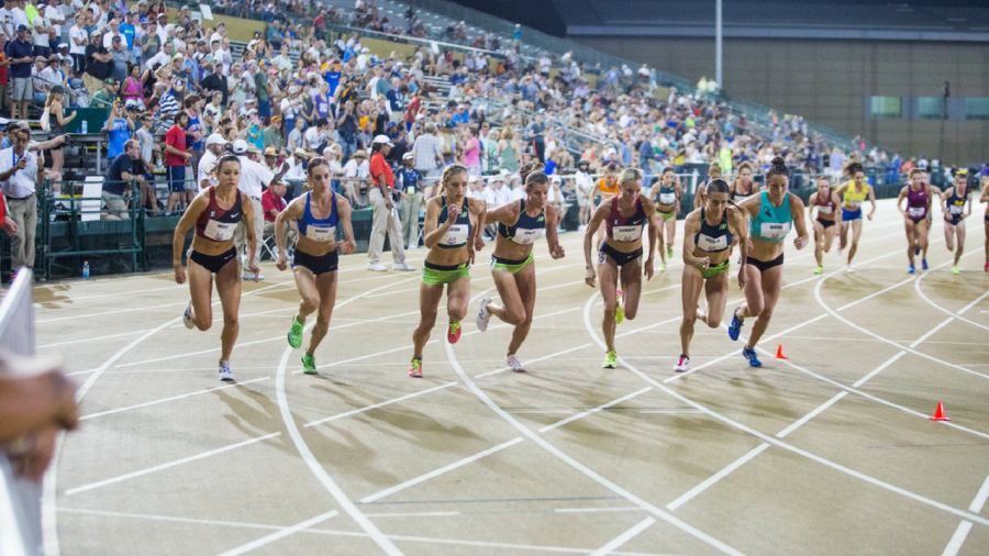 Emily Infeld (far left) begins the womens 10,000-meter run with fellow competitors Thursday at Sacramento States Hornet Stadium. Infeld finished in second place with an overall time of 31:22.67. (Photo by Nicole Fowler)