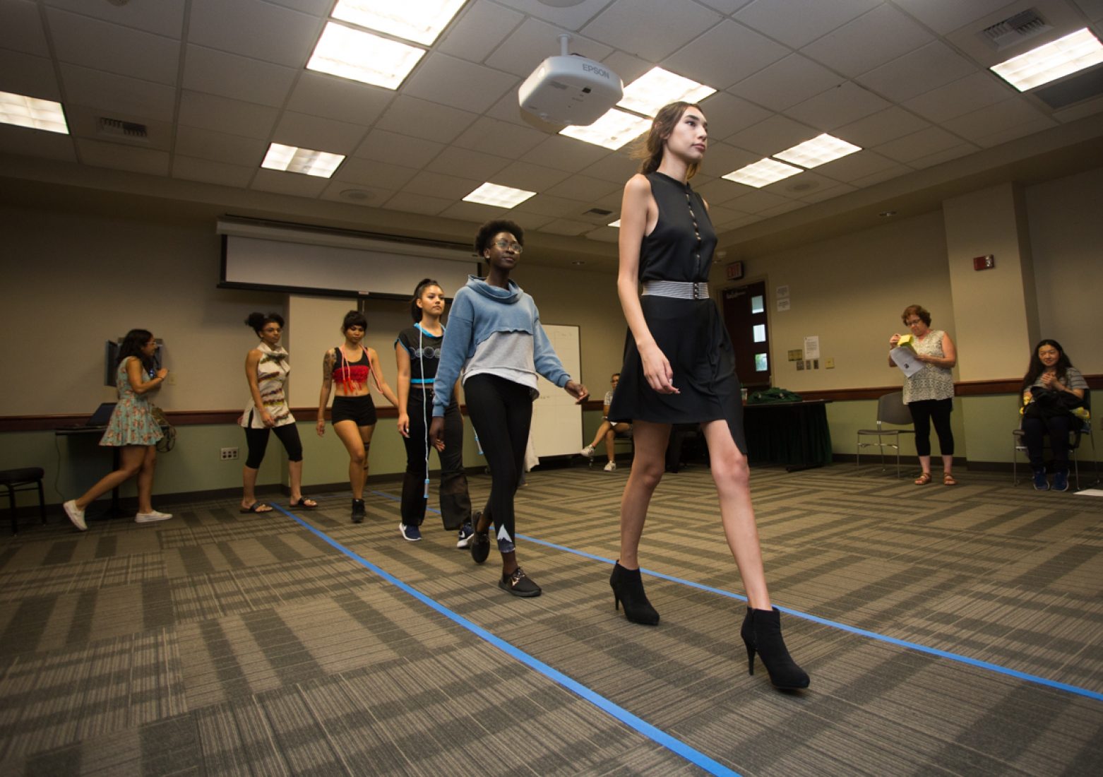 Models practice their runway walks during rehearsal in the University Union Foothill Suite on Wednesday. (Photo by Nicole Fowler)