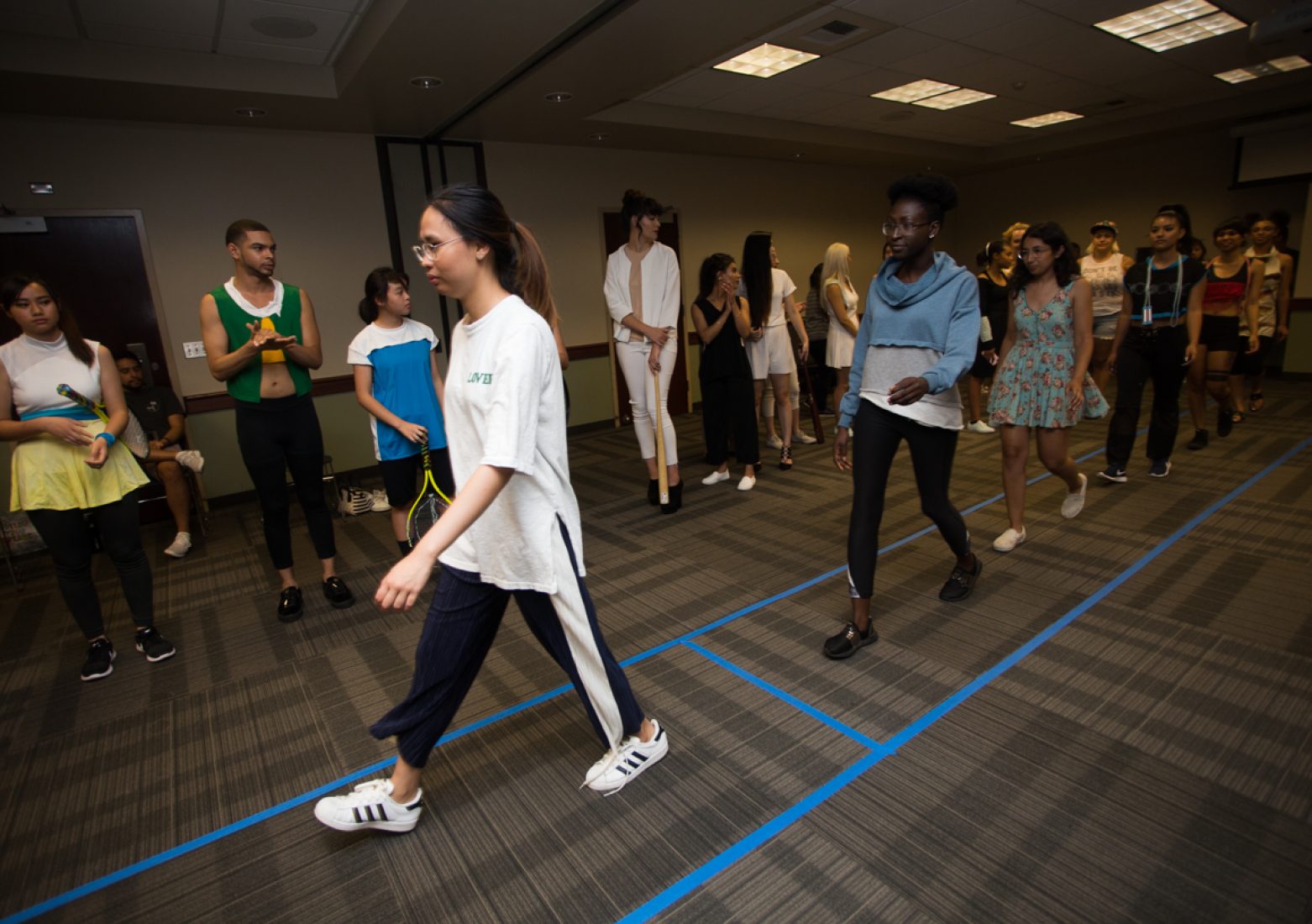 Members from the Student Fashion Association, models and volunteers practice the show’s timing during rehearsal in the University Union Foothill Suite on Wednesday. (Photo by Nicole Fowler)