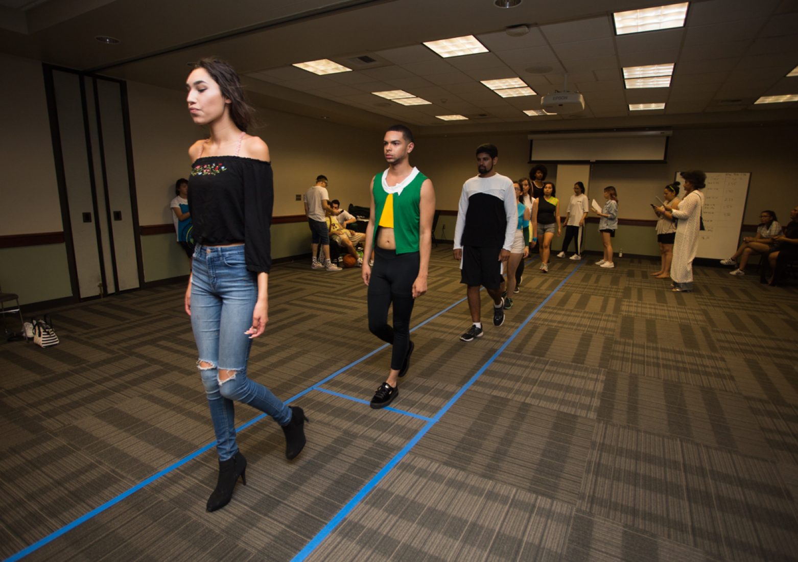 Models practice their runway walks during rehearsal in the University Union Foothill Suite on Wednesday. (Photo by Nicole Fowler)
