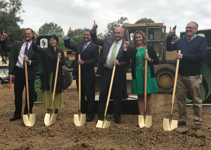 Sacramento State staff and President Robert Nelsen, third from the left, hold golden shovels at groundbreaking ceremony for Parking Structure V on Friday. (Photo by Rin Carbin)