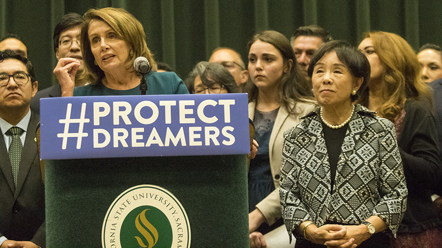 House Democratic Leader Nancy Pelosi, left, and Congresswoman Doris Matsui, right, deliver separate speeches urging Congress to pass the Dream Act during a news conference in the University Union Redwood Room Monday.
