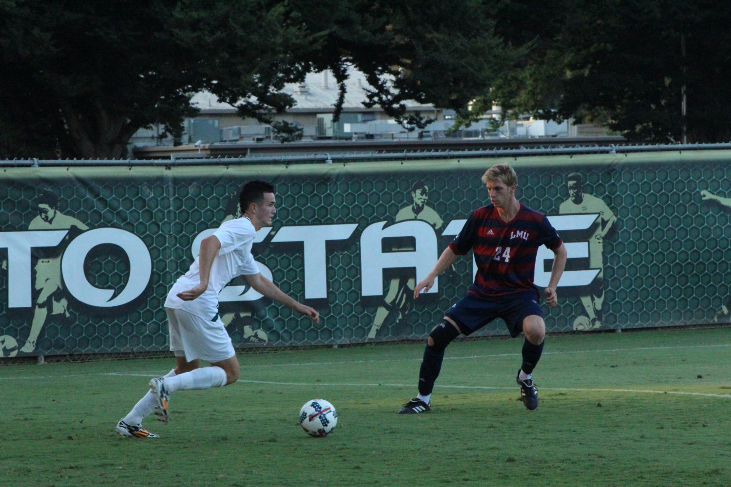 Sacramento State sophomore midfielder Christian Webb attempts to get past Loyola Marymount defender Griffin Bell Sunday, Sept. 10 at Hornet Field.