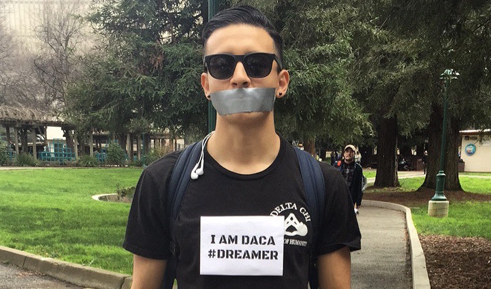 Sacramento State student Everardo Chavez wears signs on his chest identifying himself as a Deferred Action for Childhood Arrivals (DACA) participant as part of a silent protest on campus on Feb. 16. Chavez was protesting as part of A Day Without Immigrants, a nationwide protest against President Donald Trumps immigration policies.