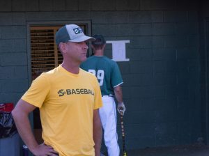 Sacramento State baseball coach Reggie Christiansen looks on as his team warms up for practice Oct. 24 at John Smith Field. Christiansen, who has signed an extension into 2024, is 219-200 overall and 96-78 in the WAC during his seven years at the helm.