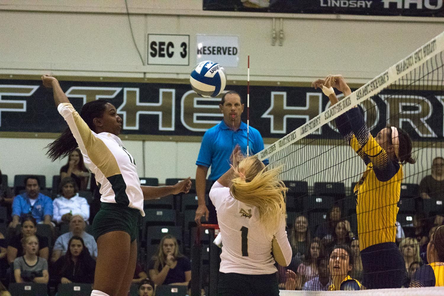 Sacramento State junior middle blocker Brie Gathright jumps to spike the ball against Northern Colorado Saturday, Oct. 7 at Colberg Court. Sac State defeated Northern Colorado 28-26, 25-22 and 25-17 in three sets.