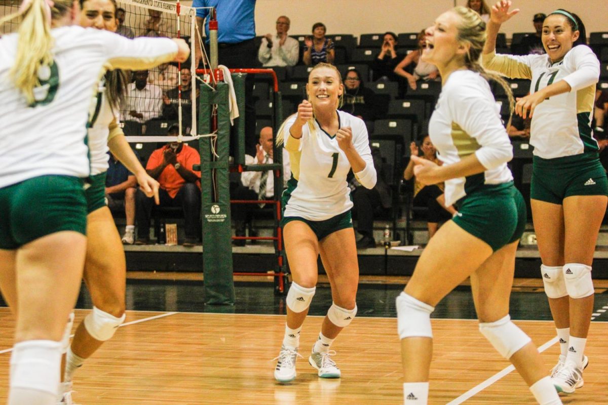 Sacramento State senior setter Kennedy Kurtz, middle, celebrates with teammates after a kill by senior outside hitter Shannon Boyle in set five against North Dakota at Colberg Court in the Nest on Thursday, Oct. 5, 2017. After defeating Portland State on Oct. 7, Sac State clinched its first Big Sky Conference regular season championship since 2007.