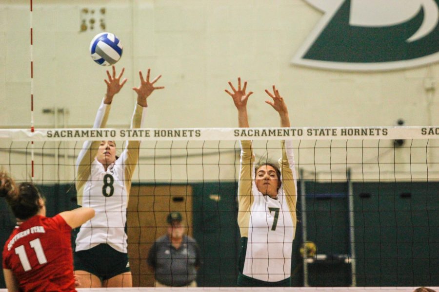 Sacramento State sophomore outside hitter Sarah Davis, left, and junior middle blocker Lana Brown, right, go for a block against Southern Utah Thursday, Oct. 12 at Colberg Court.