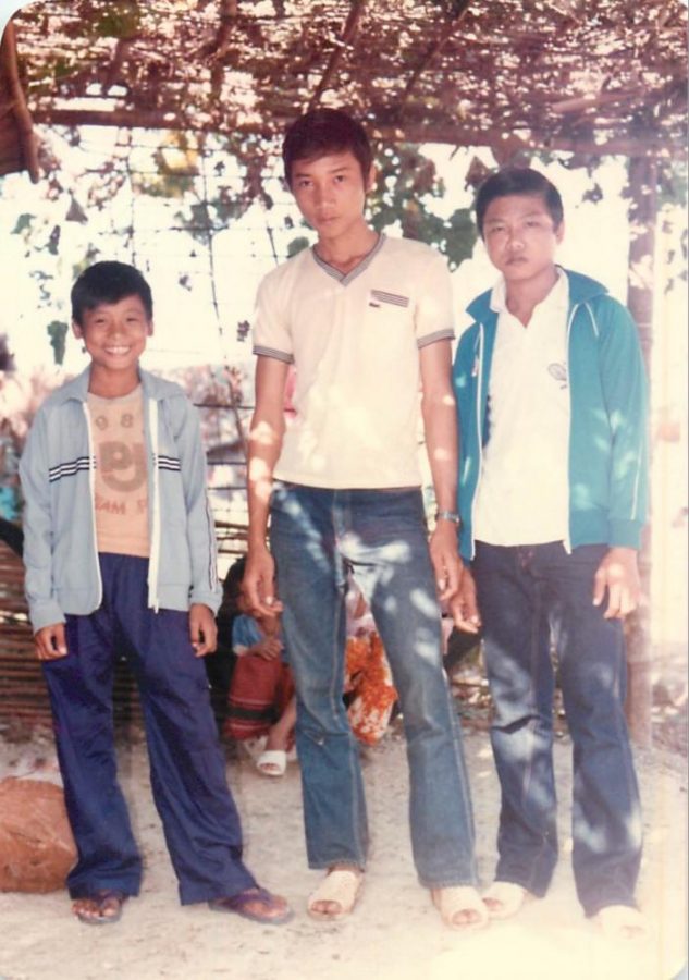 Left to right, Sedah Tath stands with his friend and older brother at the Khao-I-Dang Holding Center in Thailand in 1984. The camp took in many refugees from Cambodia after the fall of the Khmer Rouge regime.