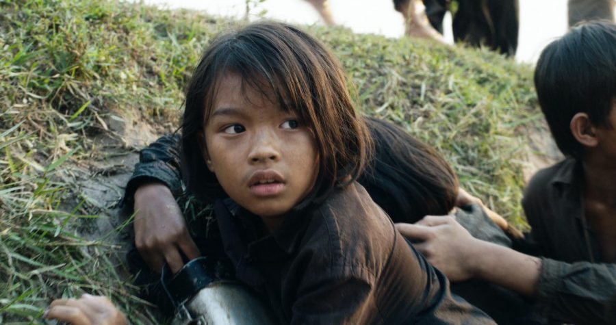 Making her on-screen debut, 9-year-old Sreymoch Sareum portrays Loung Ung in First They Killed My Father, a Netflix original film by Angelina Jolie that follows the true story of a 5-year-old girl struggling to survive life in Cambodia under the Khmer Rouge regime.
