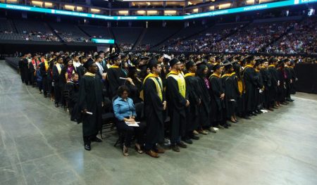 Graduates stand at the spring 2017 commencement ceremony at Golden 1 Center. Sac State announced that graduation will take place over the course of three days for the Spring 2019 ceremony.