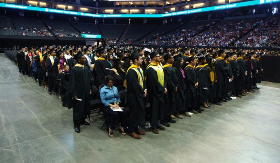 Graduates stand at the spring 2017 commencement ceremony at Golden 1 Center. Sac State announced that graduation will take place over the course of three days for the Spring 2019 ceremony.