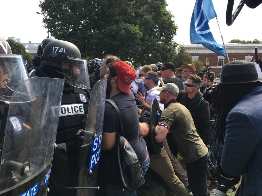 White nationalists clashed with police officers during the Unite the Right rally in Charlottesville on Aug. 13. The first step to resist this movement is to learn the sociological forces that lead people to similar extreme ideologies.