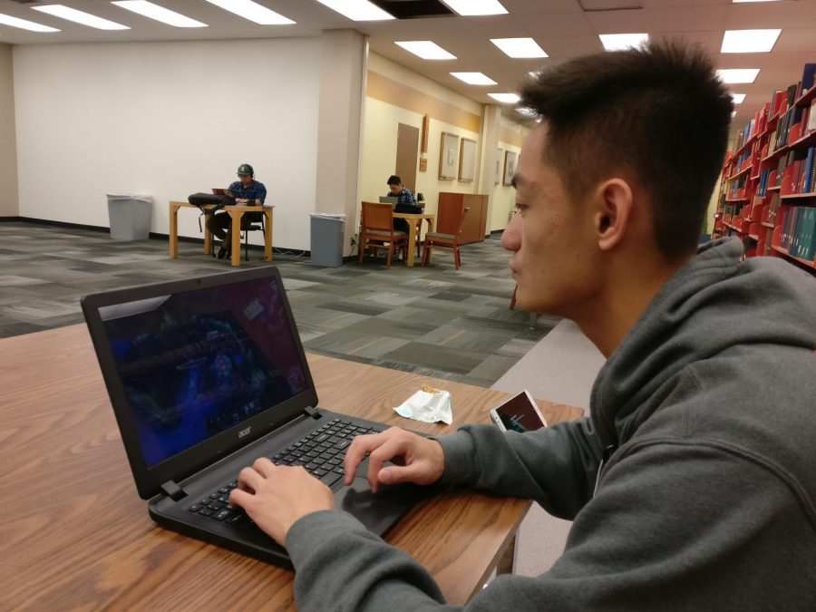 Sacramento State freshman finance major Anthony Thao plays “League of Legends” in the University Library on campus.