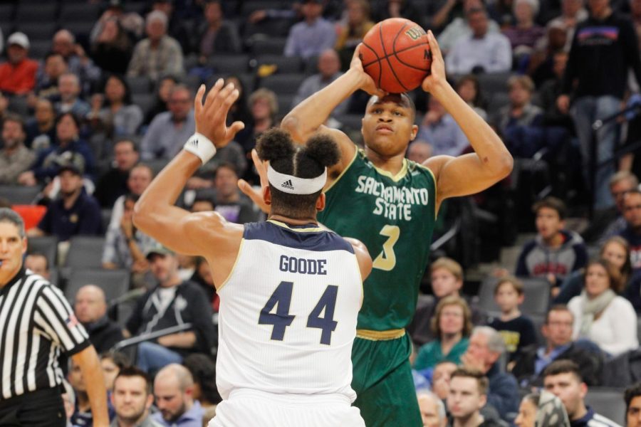 Sacramento State senior forward Justin Strings shoots the ball over UC Davis junior forward Garrison Goode Tuesday, Nov. 21 at the Golden 1 Center. Strings posted 17 points, 12 rebounds and 10 turnovers in a 64-47 loss against the Aggies.