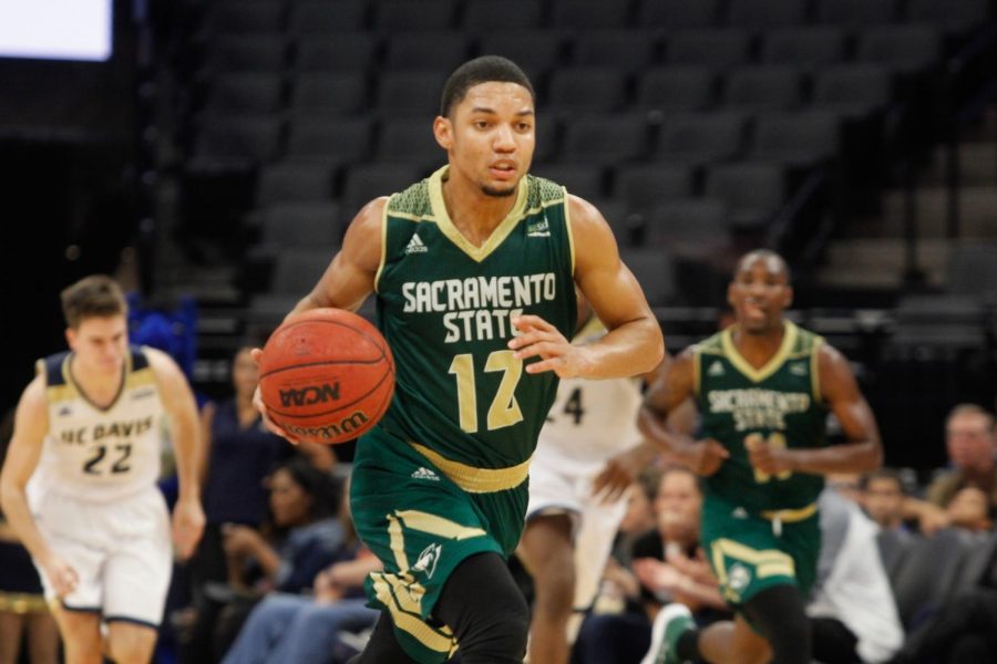 Sacramento State junior guard Jordan Tolbert dribbles the ball down the court in a 64-47 loss against UC Davis at the Golden 1 Center on Tuesday, Nov. 21, 2017. 