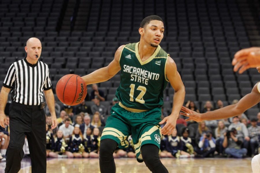 Sacramento State junior guard Jordan Tolbert dribbles the ball down the court in a 64-47 loss against UC Davis Tuesday, Nov. 21 at the Golden 1 Center.