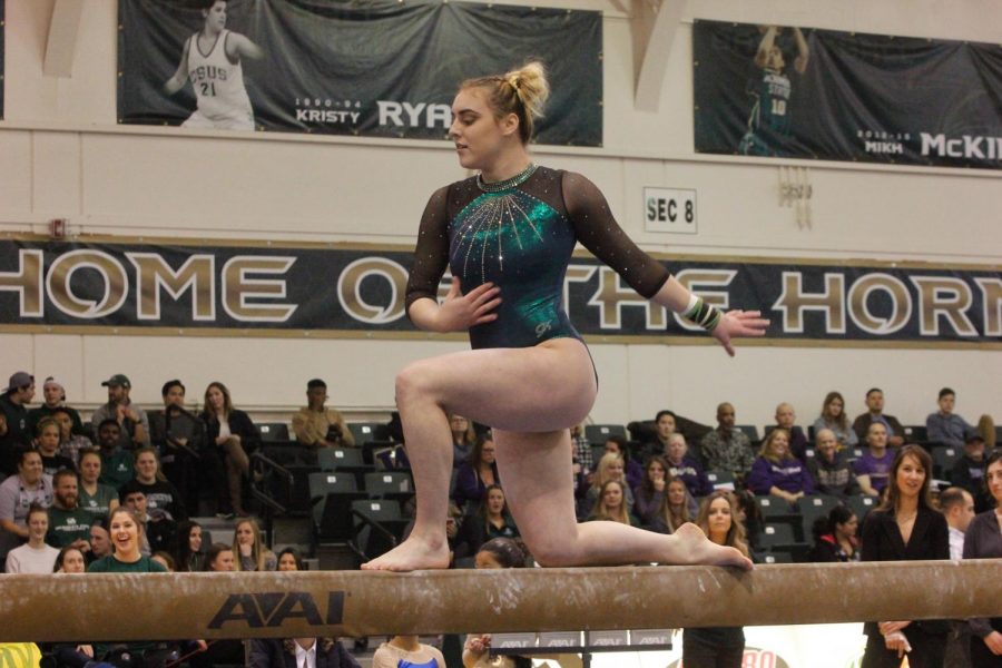 Sacramento State gymnast Lauren Rice performs her balance beam routine in a 195.350-191.500 loss to the University of Washington Friday, Jan. 12 at the Nest. Rice was helped off the floor after suffering an ankle injury during her floor routine. 