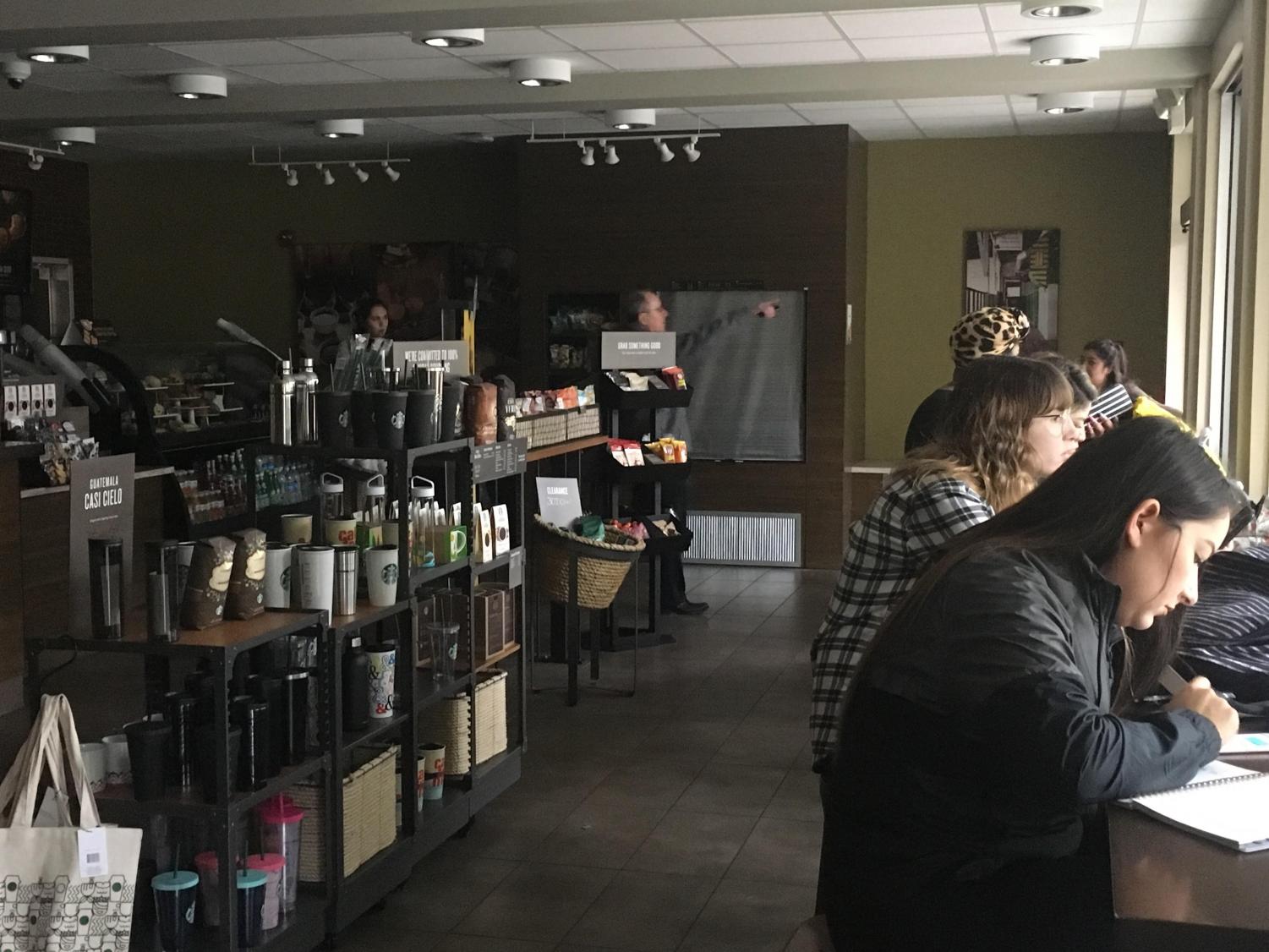 Students sit in Starbucks without light after an unscheduled campus-wide power outage took place Jan. 22. Restaurants inside River Front Center were temporarily closed and classes were cancelled in Del Norte Hall.