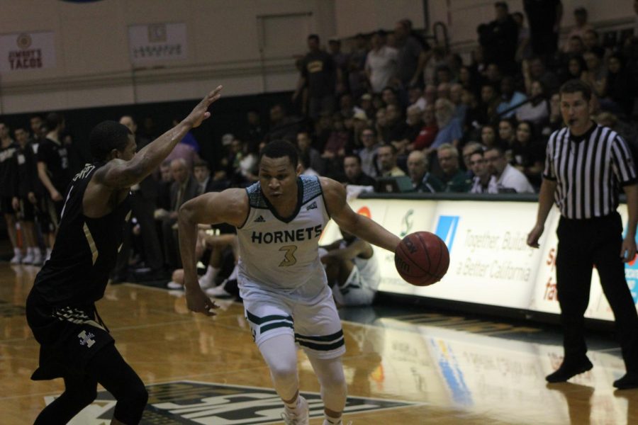 Sacramento State senior forward Justin Strings drives past an Idaho defender Saturday, Feb. 3 at the Nest. Strings scored 13 points in an 81-58 loss against the Vandals.