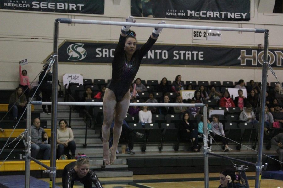 Sacramento State senior gymnast Annie Juarez performs her uneven bars routine Friday, Feb. 16 at the Nest. Juarez recorded a 9.800 on the routine and scored a career-high 39.200 as an all-arounder.