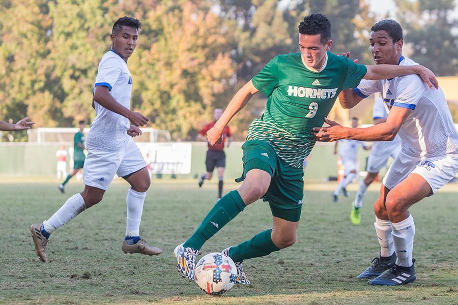 Sacramento State sophomore midfielder Christian Webb fights off UC Santa Barbara freshman defender Adrian Adames on Oct. 18 at Hornet Field. The men’s and women’s soccer programs will begin their spring preseason on March 3 and March 10, respectively, at Sac State.