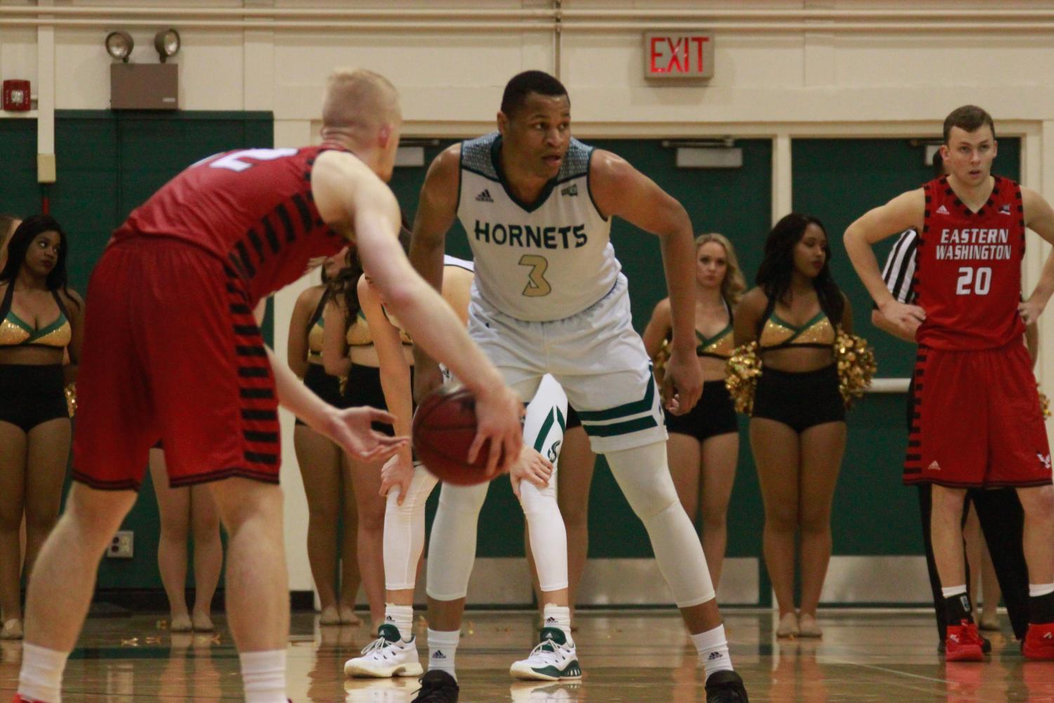 Sacramento State senior forward Justin Strings, middle, prepares to defend Eastern Washington senior guard Bogdan Bliznyuk, left, in the second half of a 74-54 loss Thursday, Feb. 1 at the Nest. Strings finished the game with 16 points, while Bliznyuk posted a season-high 40 points on 15-of-18 shooting from the field.