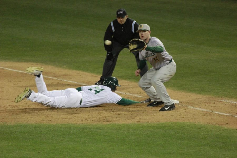 Sacramento State redshirt sophomore Matt Smith dives back to first base safely following a pickoff attempt against the University of San Francisco on John Smith Field Friday, Feb. 23, 2018. The Hornets lost to the Dons 2-0 after 11 innings.