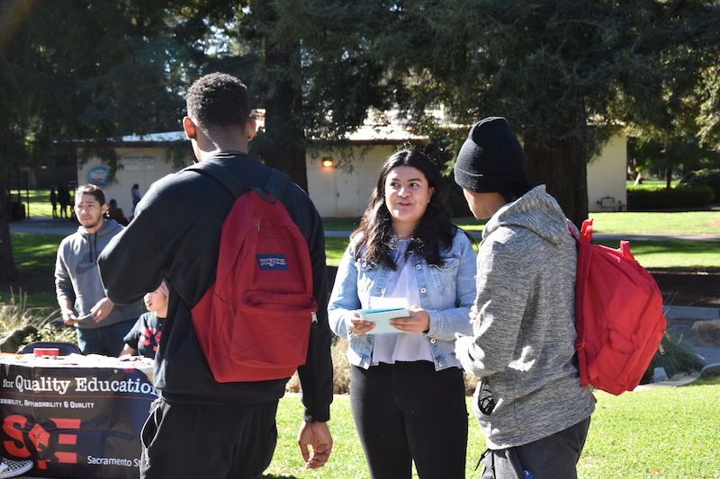 Yahaira Victorino, a biochemistry major, hands out flyers inviting students to join a protest arranged by the Students for Quality Education at the capitol on April 4. The organization will be protesting the gap in state funding for the CSU and the $228 tuition increase proposed by the CSU. 