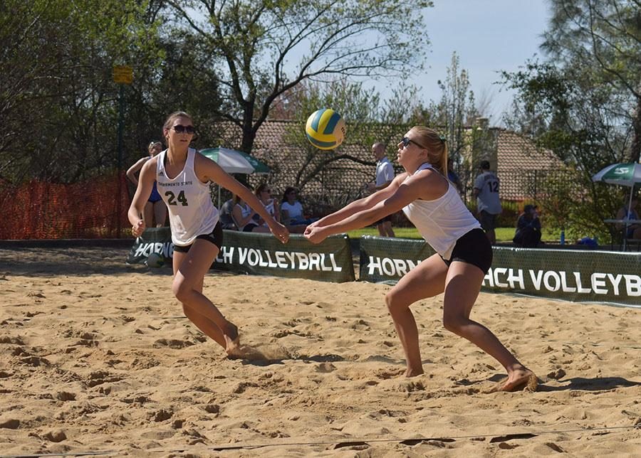 Sacramento State then-junior Kennedy Kurtz bump sets the ball for then-freshman Sarah Davis in a match against San Jose State at Livermore Community Park in Folsom on Saturday, March 11, 2017. Sac State will begin its sixth season of beach volleyball on Friday at the Stanford Tournament in Palo Alto.