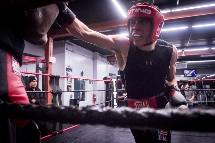 Kevin Montano lands a punch on his sparring partner while training at Midtown Fitness and Boxing in Sacramento on Tuesday, Feb. 20, 2018. Montano, a junior at Sacramento State, secured his spot as a member of Team USA in December and now stays for weeks at a time with all expenses paid at the U.S. Olympic Training Center in Colorado Springs, Colo. in preparation for international competitions with other prospective Olympic athletes. 