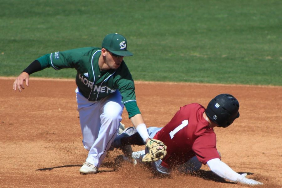 Sacramento State sophomore shortstop Josh Urps tags out Santa Clara University senior infielder Joe Becht during a steal attempt at second base at John Smith Field on Sunday, March 11, 2018. The Hornets defeated Santa Clara 4-1.