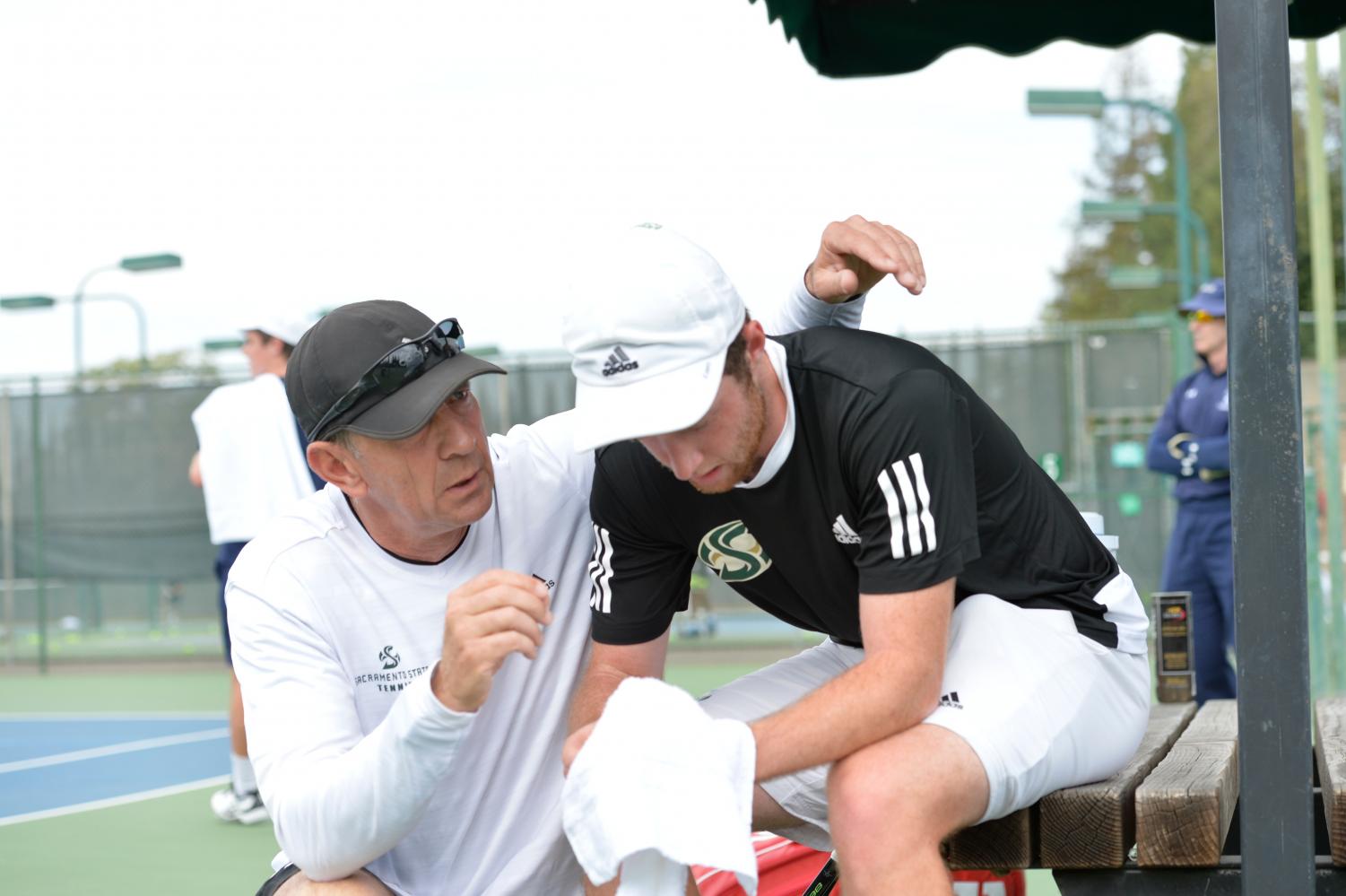 Former Sacramento State head coach Vyacheslav “Slava” Konikov talks with former player and current volunteer assistant Christopher Clayton after a match at the Rio del Oro Raquet Club. Konikov resigned after 11 years with the men's tennis program to coach professionally in Europe.