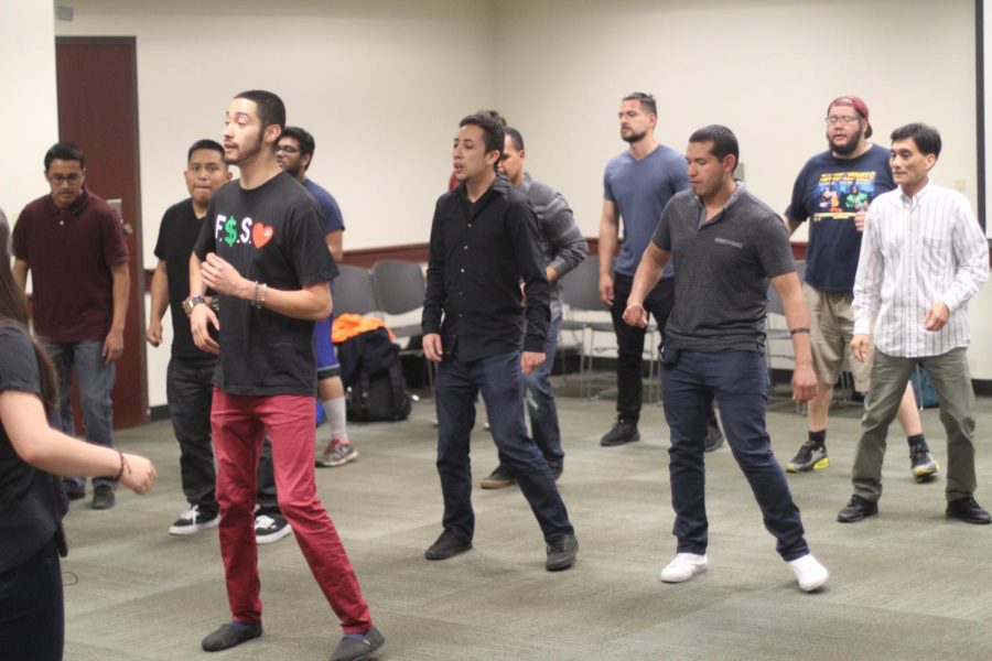 Instructor Jimmy Mendoza teaches some Bachata moves at Salsa Loca in the University Union.